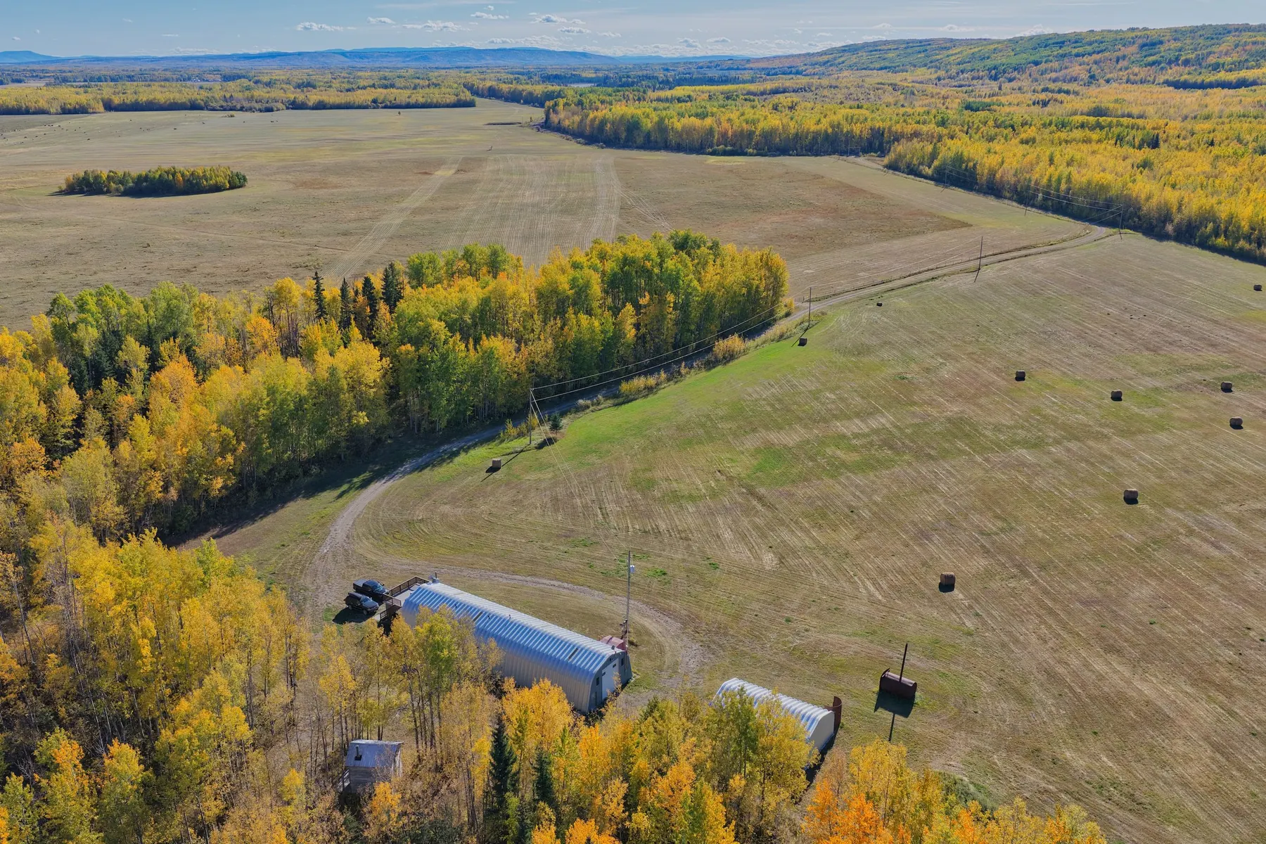 Aerial view of a rural farm with fall colours