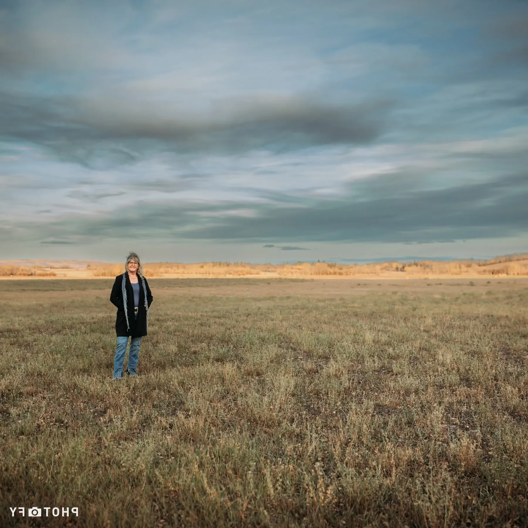 Nyla LePine standing in an open Peace Country field